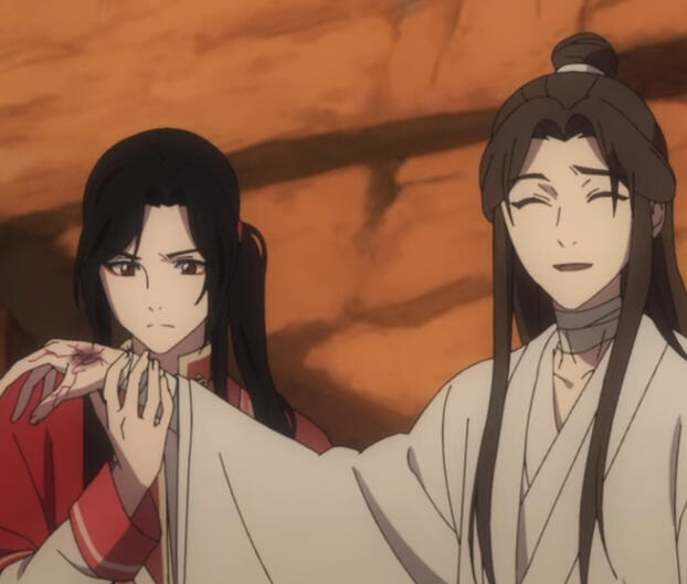 San Lang examining Xie Lian's hand after it was bit by a scorpion-snake.